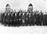 Bluff Missionaries -- Can you identify the unknown? BACK ROW: Left to right 1-Fletch Hammond, 7-Jens Nielson (son), 8-Joe Nielson, 11-France Nielson, 12-Bishop Jens Nielson, 13-Bishop Hanson Bayles.  MIDDLE ROW: 3-Monroe Redd, 4-Dan Perkins, 7-Walter C. Lyman, 8-Jacon Adams. FRONT ROW: 1-Albert R. Lyman, 3-George Adams, 7-Peter Allen, 11 Joe Barton. Charles Goodman Photo